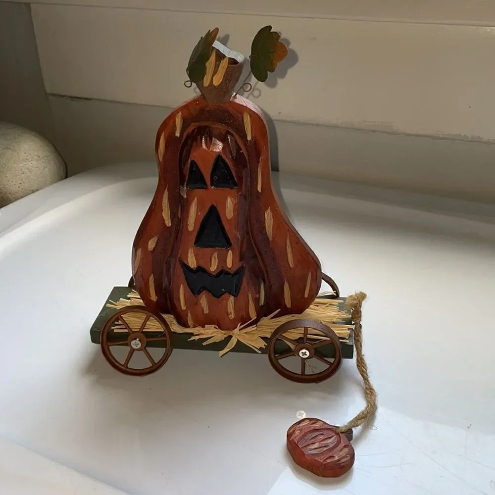 Halloween/Autumn wooden Jack O Lantern on a green wagon rolling decoration‎